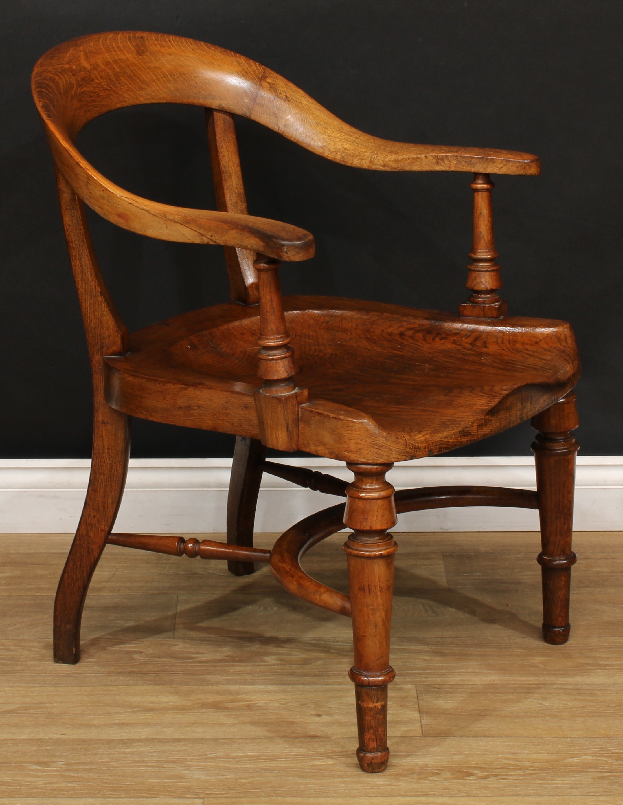 A Victorian oak desk chair, curved cresting rail, turned arm posts, saddle seat, turned forelegs, - Image 2 of 4