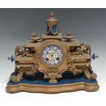 A 19th century French porcelain mounted gilt metal mantel clock, 8cm diam inscibed with Roman