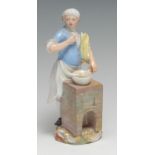 A Meissen figure of a cook from the Cris de Paris, standing over a brick furnace and tasting the
