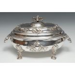 A large George II Rococo silver soup tureen, cast and applied with turbaned masks, flowering swags
