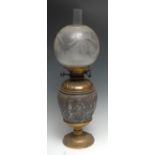 A 19th century silvered and gilt-metal ovoid table oil lamp, in the Grand Tour taste, chased after