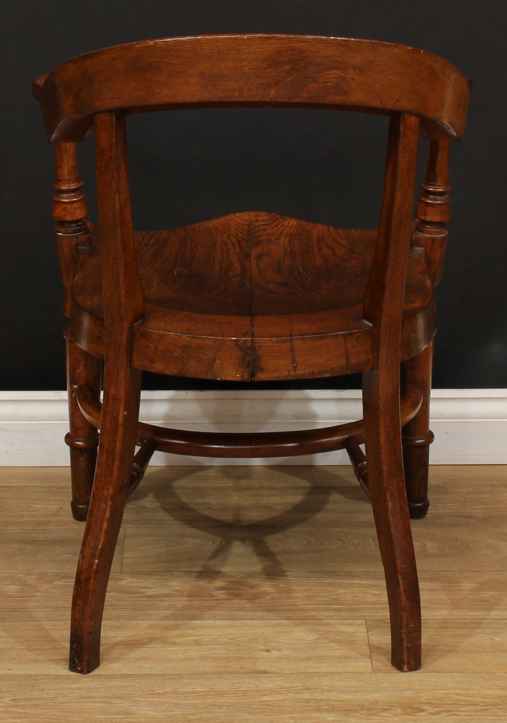 A Victorian oak desk chair, curved cresting rail, turned arm posts, saddle seat, turned forelegs, - Image 4 of 4