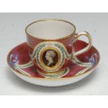A Chelsea Derby teacup and saucer, painted in monochrome with gilt oval portrait cartouches, blue