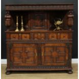 A 17th century design oak duodarn, rectangular top above a panel door, two short drawers and a
