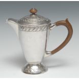 Liberty & Co - an Arts and Crafts silver covered jug, chased with repetitive bands of acanthus