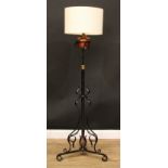 An Arts & Crafts wrought iron, copper and brass standard lamp, in the manner of W.A.S Benson,