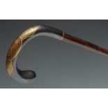 A 19th century gold-damascened steel and bamboo walking stick, crook-shaped handle, tapering cane,