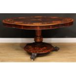 A 19th century Irish Killarney marquetry, yew and arbutus centre table, shaped top inlaid with