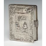 A 19th century Continental novelty table snuff or tobacco box, in the form of a book, chased in