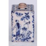 An 18th century delft square tea caddy, painted in tones of blue in the Chinoiserie taste with