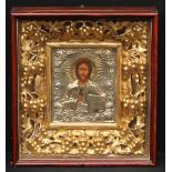 A substantial 19th century Eastern Orthodox gilt and silver coloured metal icon, depicting Christ