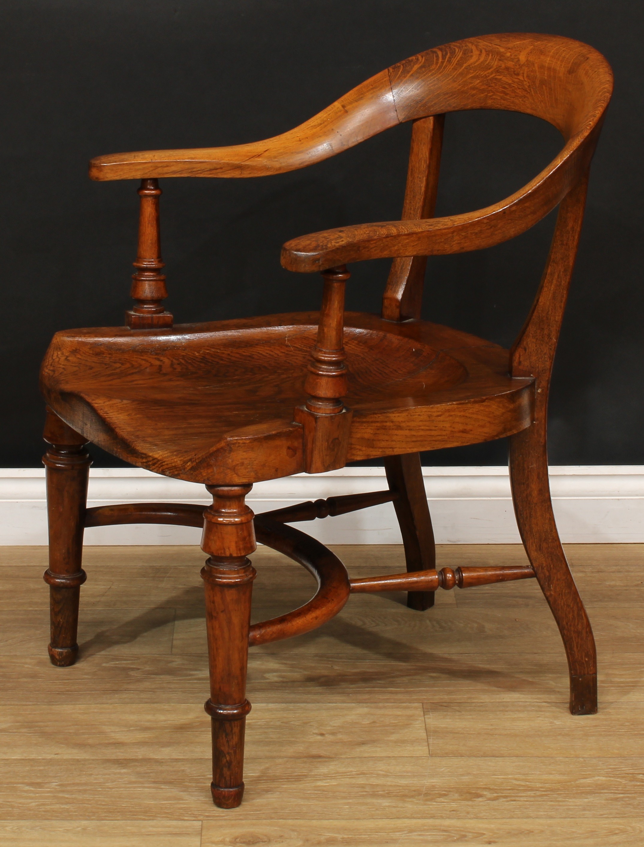 A Victorian oak desk chair, curved cresting rail, turned arm posts, saddle seat, turned forelegs, - Image 3 of 4