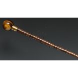 An Edwardian tiger's eye and bamboo lady's parasol, by Brigg, stamped, spherical pommel, pleated