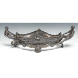 An Art Nouveau W.M.F. boat shaped centrepiece, cast with mermaid and boy hauling the boat, in relief