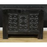 A 17th century oak blanket chest, later hinged top set with three raised and fielded panels, the