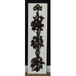 A 19th century oak pendant, in the manner of Grinling Gibbons, carved as ribbon-tied flowering