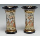 A pair of Japanese Satsuma trumpet-shaped vases, typically painted with reserves of traditional