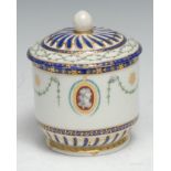A Chelsea Derby sucrier and cover, painted in monochrome with gilt oval portrait cartouches, green