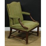 A 19th century mahogany Gainsborough armchair, chapeau de gendarme back, stuffed-over upholstery,