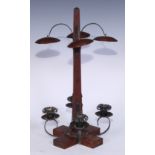 An American Arts and Crafts oak and copper candelabrum, obelisk-form column with four planished heat
