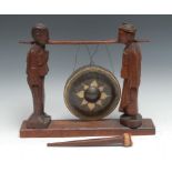 A Chinese hardwood gong, held by attendants, 30cm high