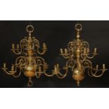 A near pair of Dutch brass twelve-light chandeliers, 64cm high overall, 61cm wide