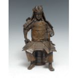 Japanese School. a brown patinated bronze, 20th century, of a samurai warrior, seated wearing
