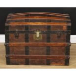 A 19th century wood-bound leather dome-top steamer trunk, tooled with geometric motifs and an