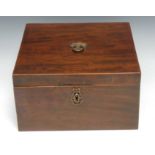 An unusual and large late George III mahogany square double-tea caddy, the hinged cover enclosing