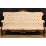 A 19th century Anglo-Indian hardwood sofa, shaped serpentine back with shell and scroll cresting,