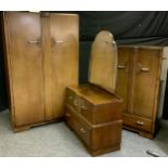 An Art Deco oak three-piece bedroom suite, comprising a double wardrobe 183cm high, 116cm wide; a