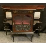 A late Victorian mahogany side cabinet, shaped top above a long drawer and a glazed cupboard door