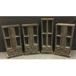 A set of three tribal inspired exotic wood CD racks, 88cm high, 45cm wide, 17.5cm deep; another,