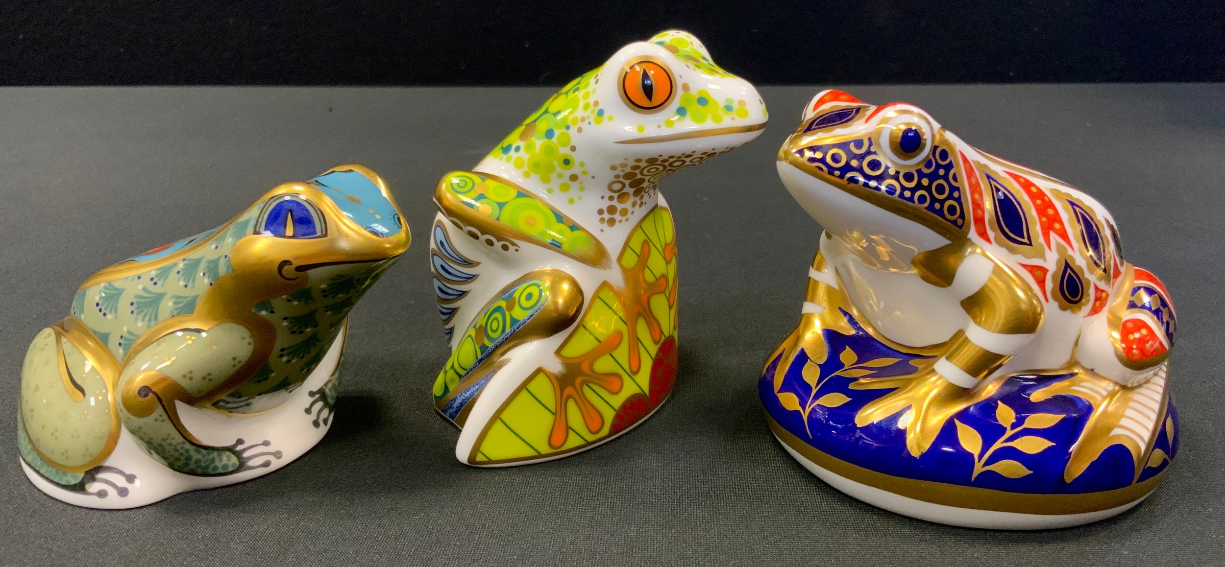 A Royal Crown Derby paperweight, Tree Frog, gold stopper, printed mark; another, Fountain Frog;