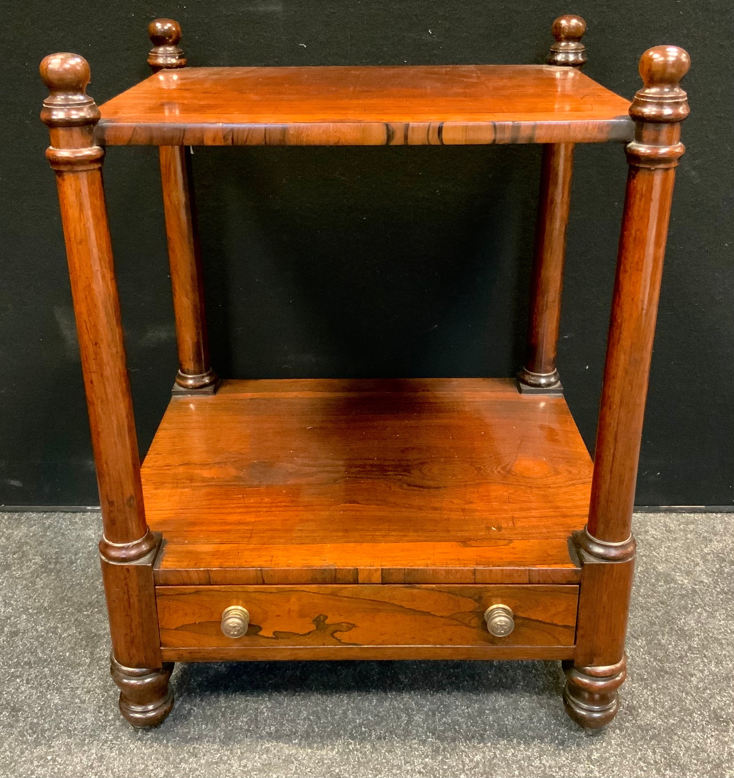 A Victorian rosewood two-tier whatnot, rectangular top above a short drawer, tapered cylindrical