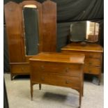 A 20th century oak bed room suite comprising a double wardrobe, 190cm high, 117cm wide; a dressing