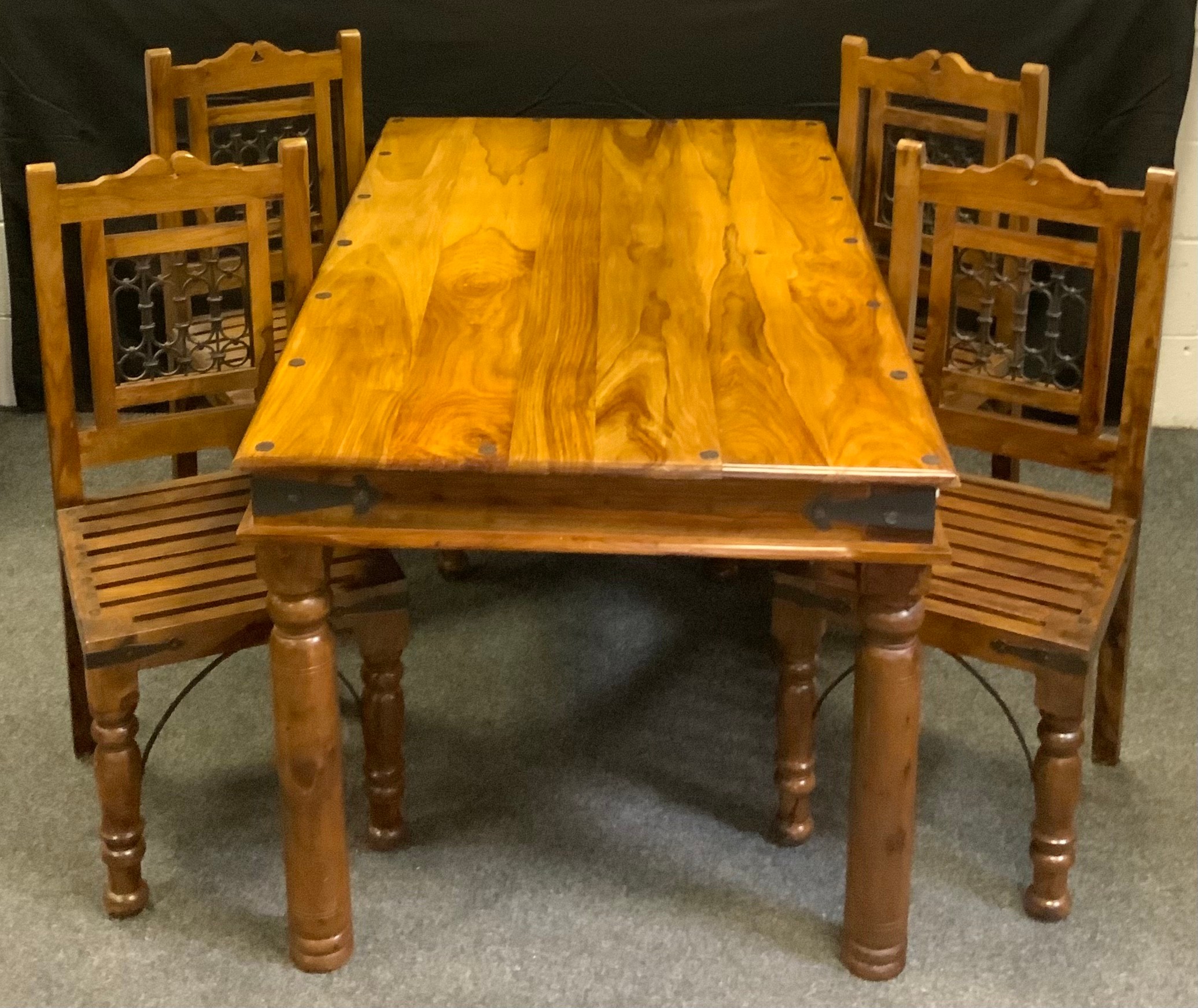 A 20th century rectangular exotic hardwood dining table, metal studded top, , iron strap bound