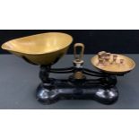 A set of Libra scale Co cast iron and brass scales, four bell weights