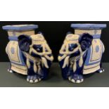 A pair of Chinese jardiniere stands, as Elephants standing, 43cm high, 45cm long, 22cm wide