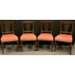 A set of four Victorian mahogany dining chairs, carved cresting rail and splat, turned legs.(4)
