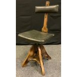 A late 19th century Glenister Works draughtman's chair, original height adjustable padded back and