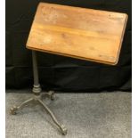 A Daytona Florence Victorian style pine and cast iron reading stand, telescopic stand, paw feet,