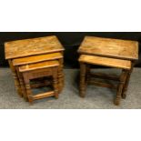 A 20th century oak nest of three tables, 45cm high, 50cm wide; another oak nest of tables.(2)