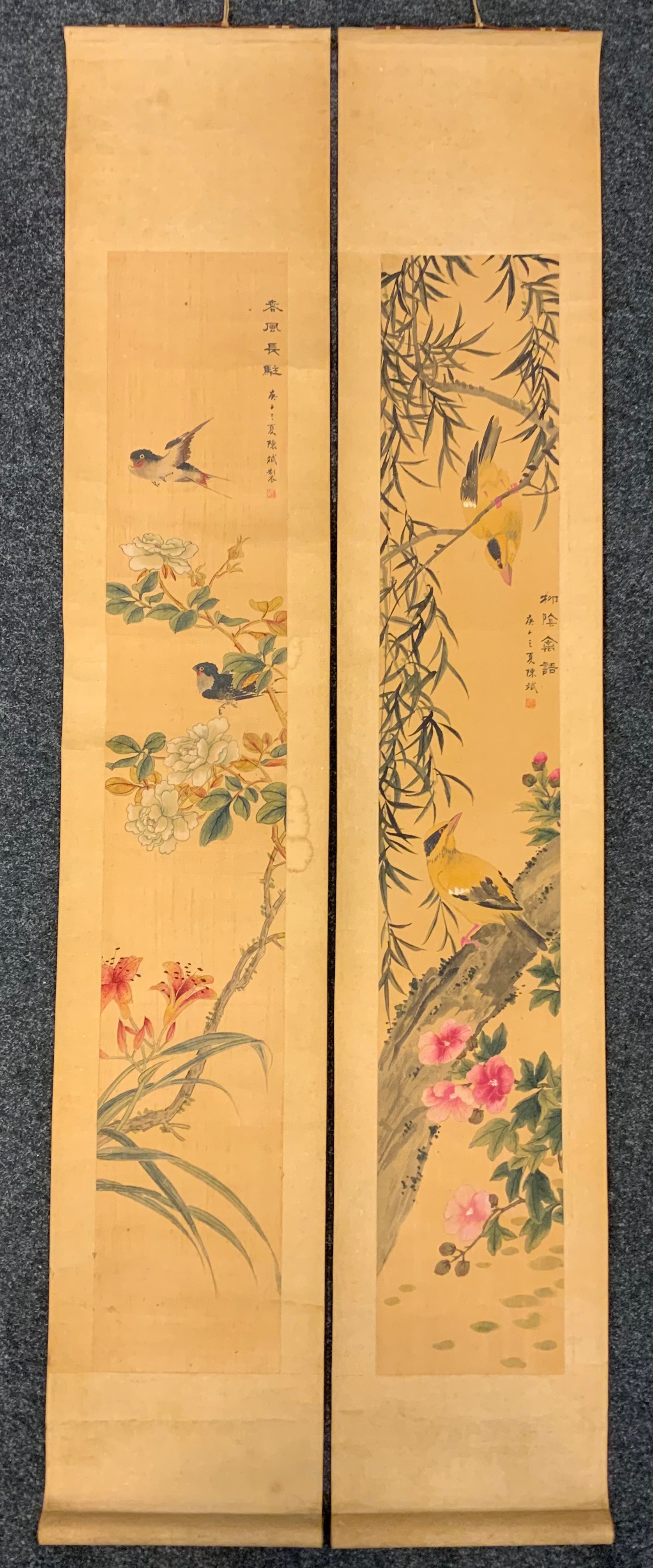A pair of Japanese wall scrolls, birds amongst blossoms, signed with characters (2)