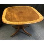 A tilt-top mahogany breakfast table, crossbanded satinwood, rounded rectangular top, cylindrical