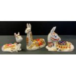 A Royal Crown Derby paperweight, Llama, gold stopper. printed mark; Donkey; Donkey Foal (3)