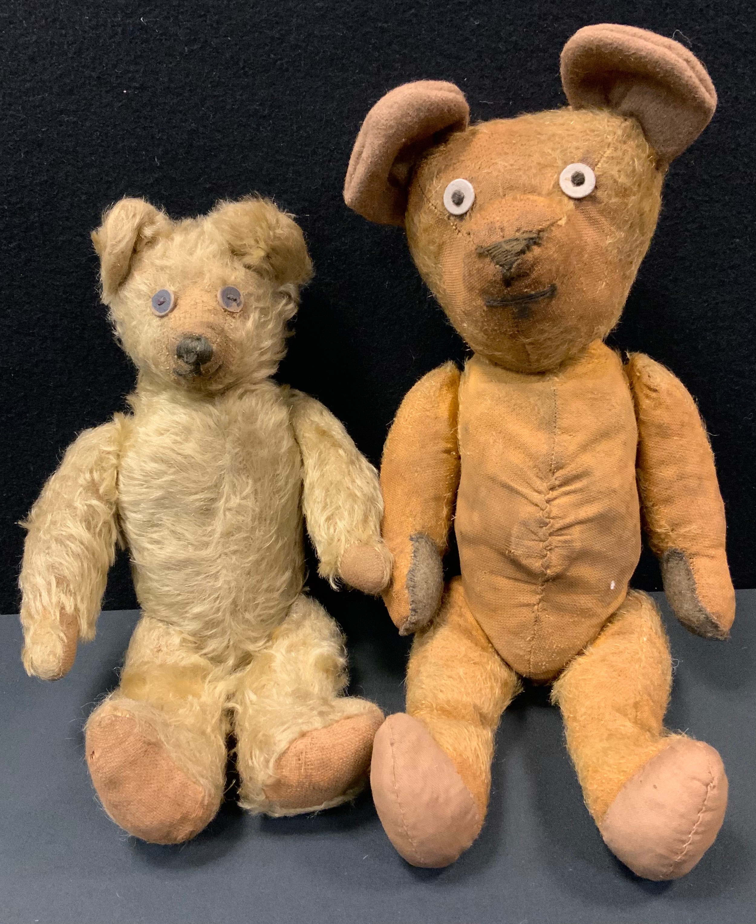 Teddy Bears - an early 20th century centre seam bear, short upturned nose, felt ears, button eyes,