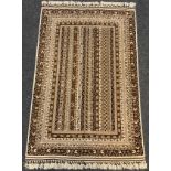 A fine hand-made Telle Torkaman rug / carpet, woven in muted tones of umber, brown, and cream, 190cm