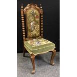A Victorian walnut side chair, anthemion cresting, arched beaded and tapestry back and stuffed-