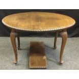 A Queen Anne style mahogany wing out dining table, oval top, cabriole legs, 75cm high, 92cm wide,